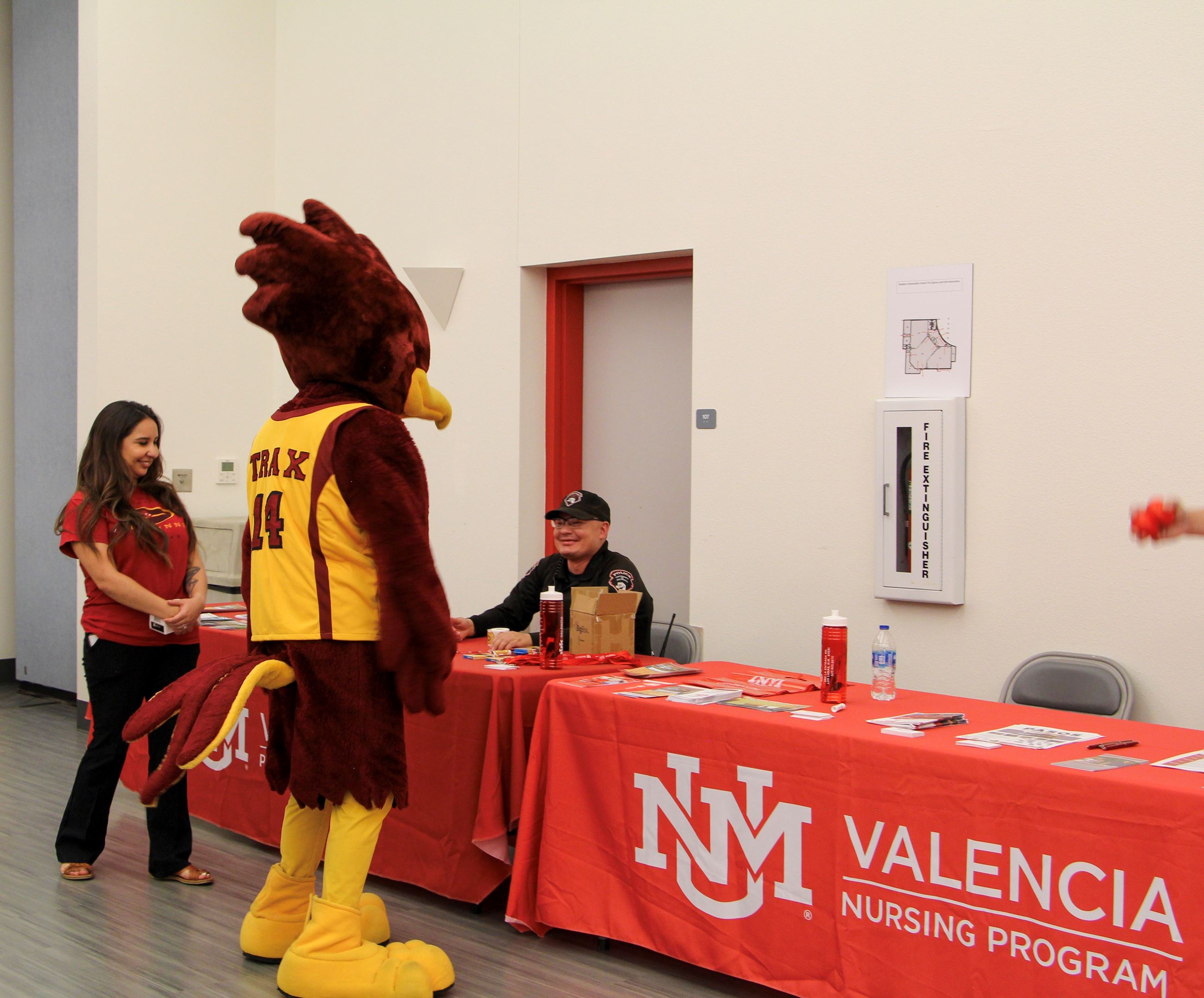 NNO Belen Mascot having a discussion with UNM-VC